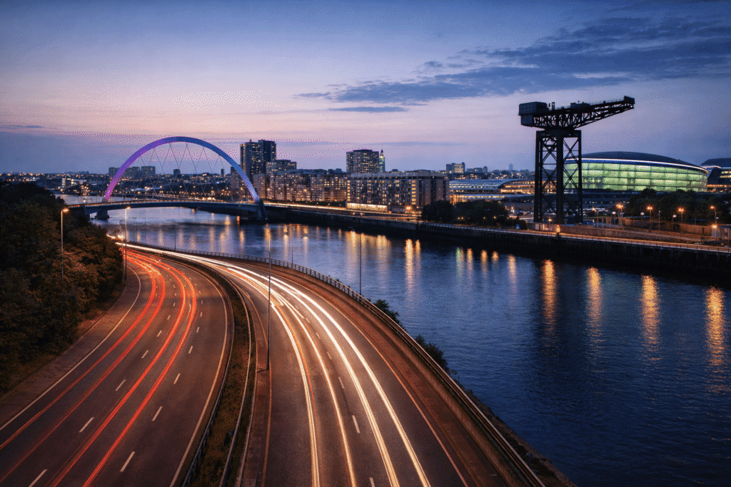 Dedicated courier service operating in Glasgow with long-exposure road light trails